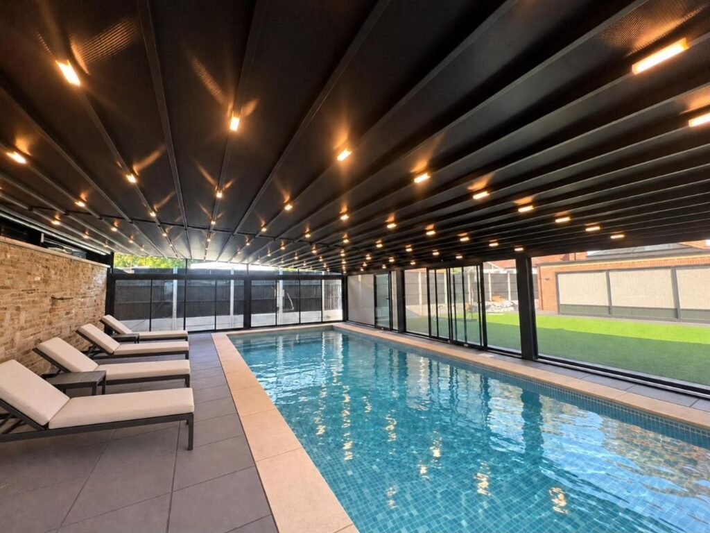Retractable PVC roof enclosure over a swimming pool, Braemar Gardens, London