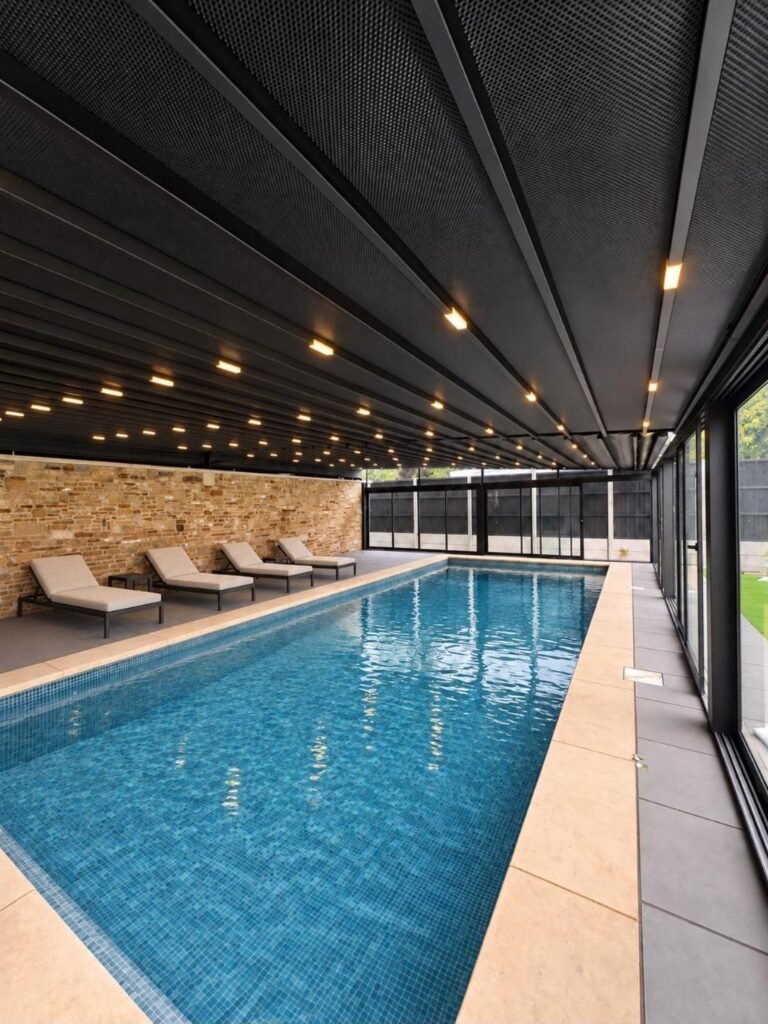 Retractable PVC roof enclosure over a swimming pool, Braemar Gardens, London