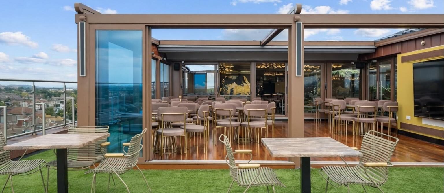 Retractable glass roof rooftop bar at Godino Sky Bar, Ilford