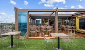 Retractable glass roof rooftop bar at Godino Sky Bar, Ilford