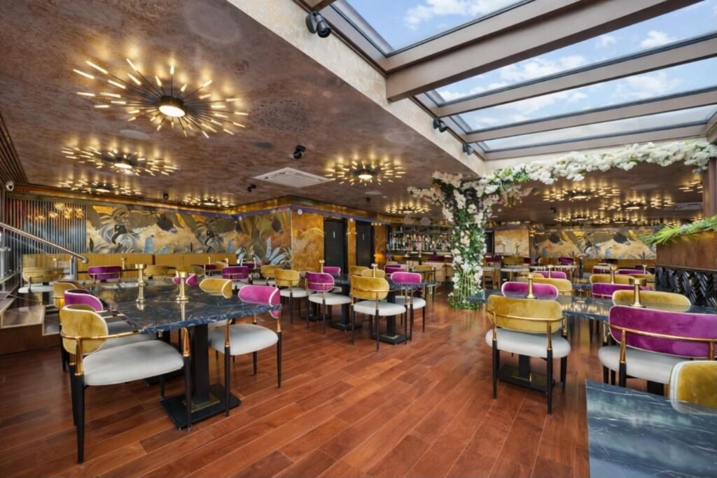 Retractable glass roof rooftop bar at Godino Sky Bar, Ilford