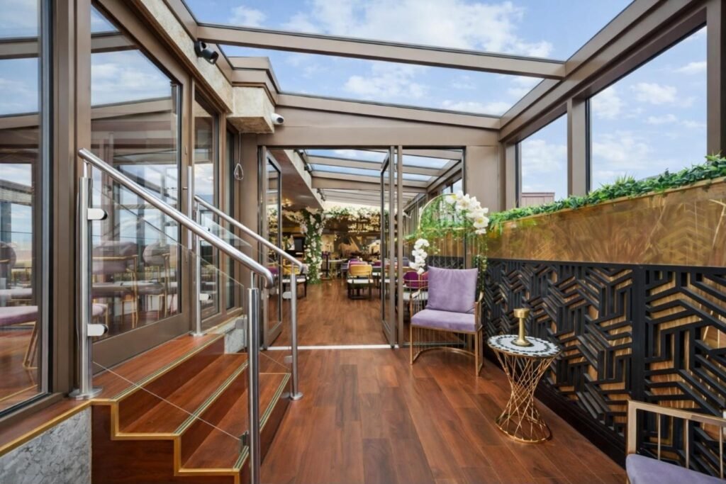 Retractable glass roof rooftop bar at Godino Sky Bar, Ilford