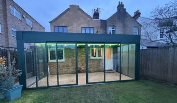 Motorised retractable glass roof garden room with sliding doors, Graham Road, London