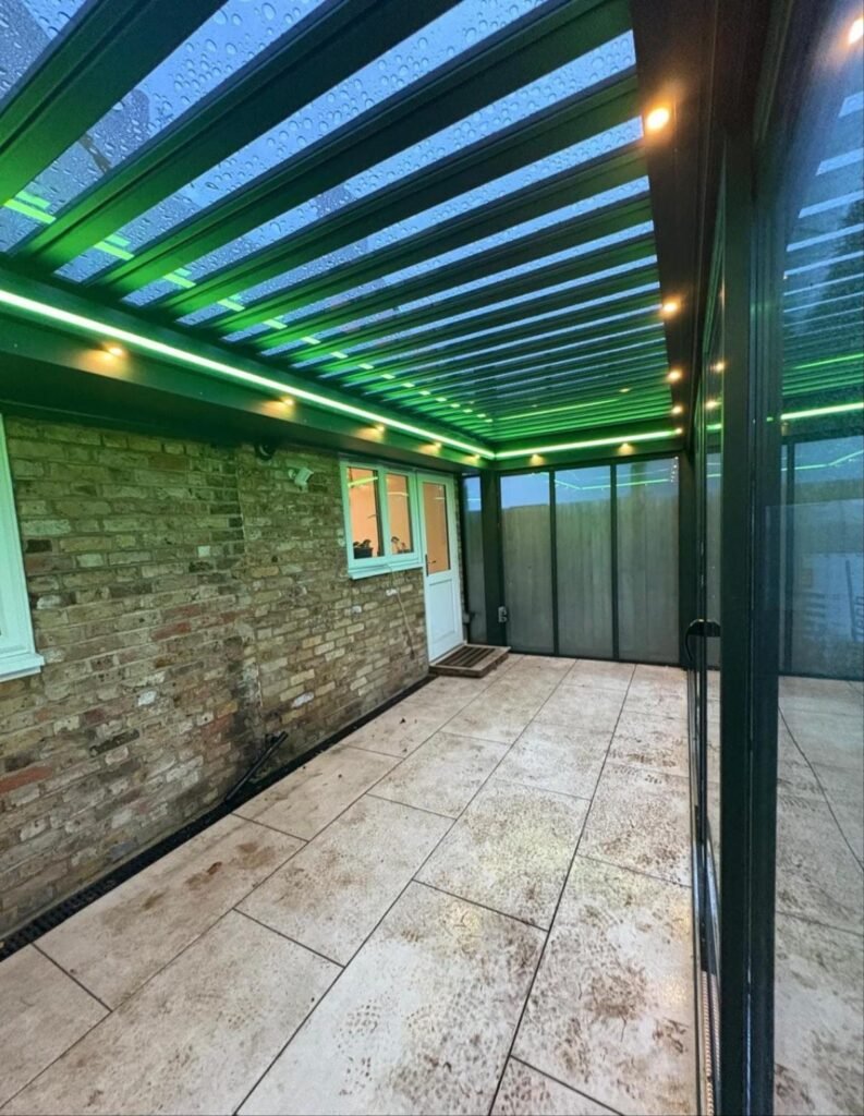 Motorised retractable glass roof garden room with sliding doors, Graham Road, London