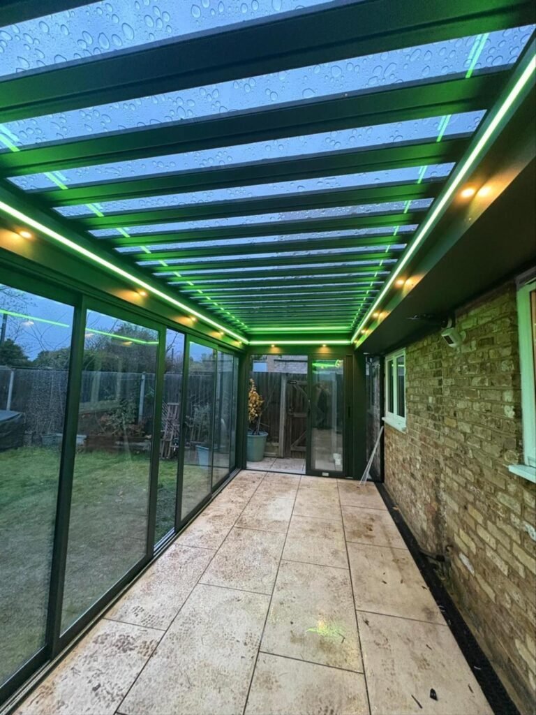 Motorised retractable glass roof garden room with sliding doors, Graham Road, London