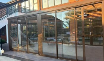 Fixed glass roof extension with sliding glass doors at Horwood House Hotel, Milton Keynes