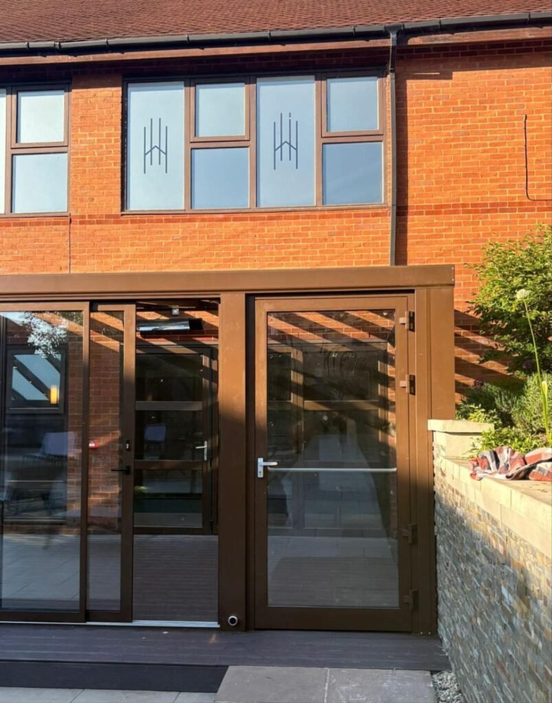 Fixed glass roof extension with sliding glass doors at Horwood House Hotel, Milton Keynes