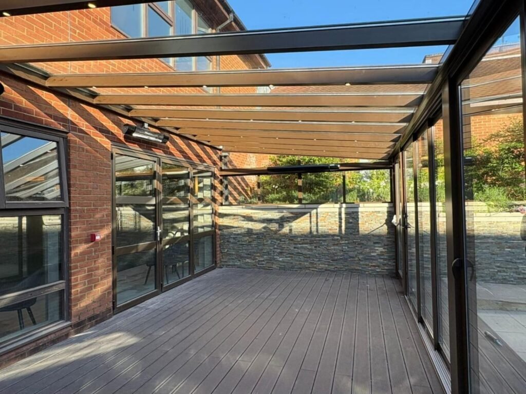 Fixed glass roof extension with sliding glass doors at Horwood House Hotel, Milton Keynes